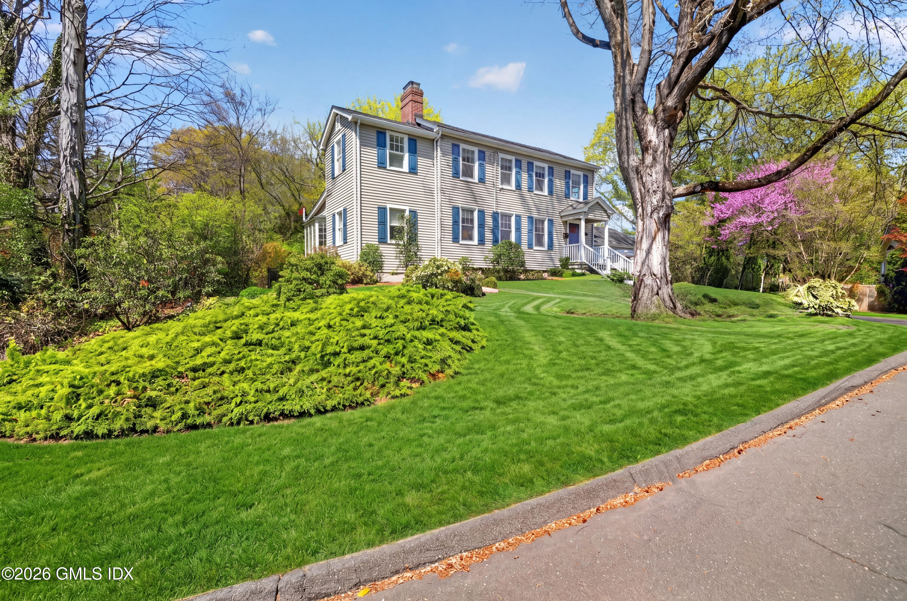 20 Ridge Road Cos Cob, CT 06807 - Photo 3 of 36 a front view of a house with a yard