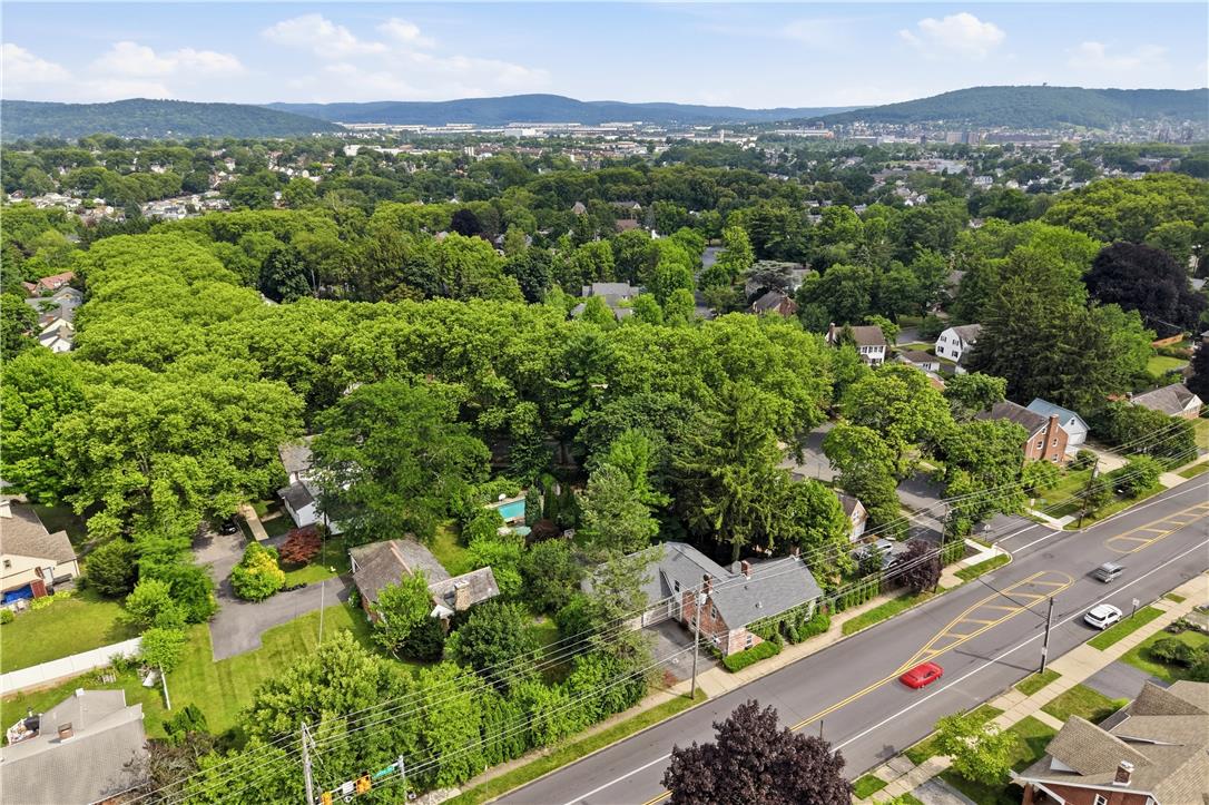 2014 Linden Street Bethlehem, PA 18017 - Photo 80 of 85 An aerial perspective reveals a tree-lined neighborhood with residential streets and distant hills.