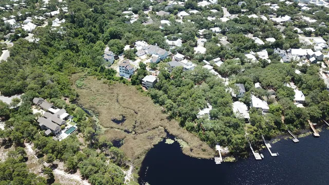 an aerial view of a houses with a yard
