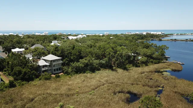an aerial view of a house with a lake view