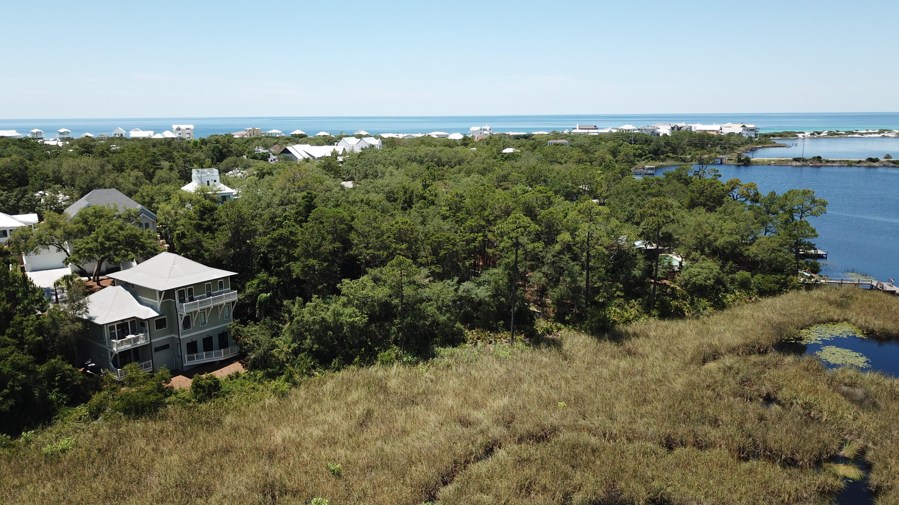 Lot 2 Cove Creek Ln Inlet Beach Inlet Beach, FL 32461 - Photo 15 of 23 an aerial view of a house with a yard and lake view