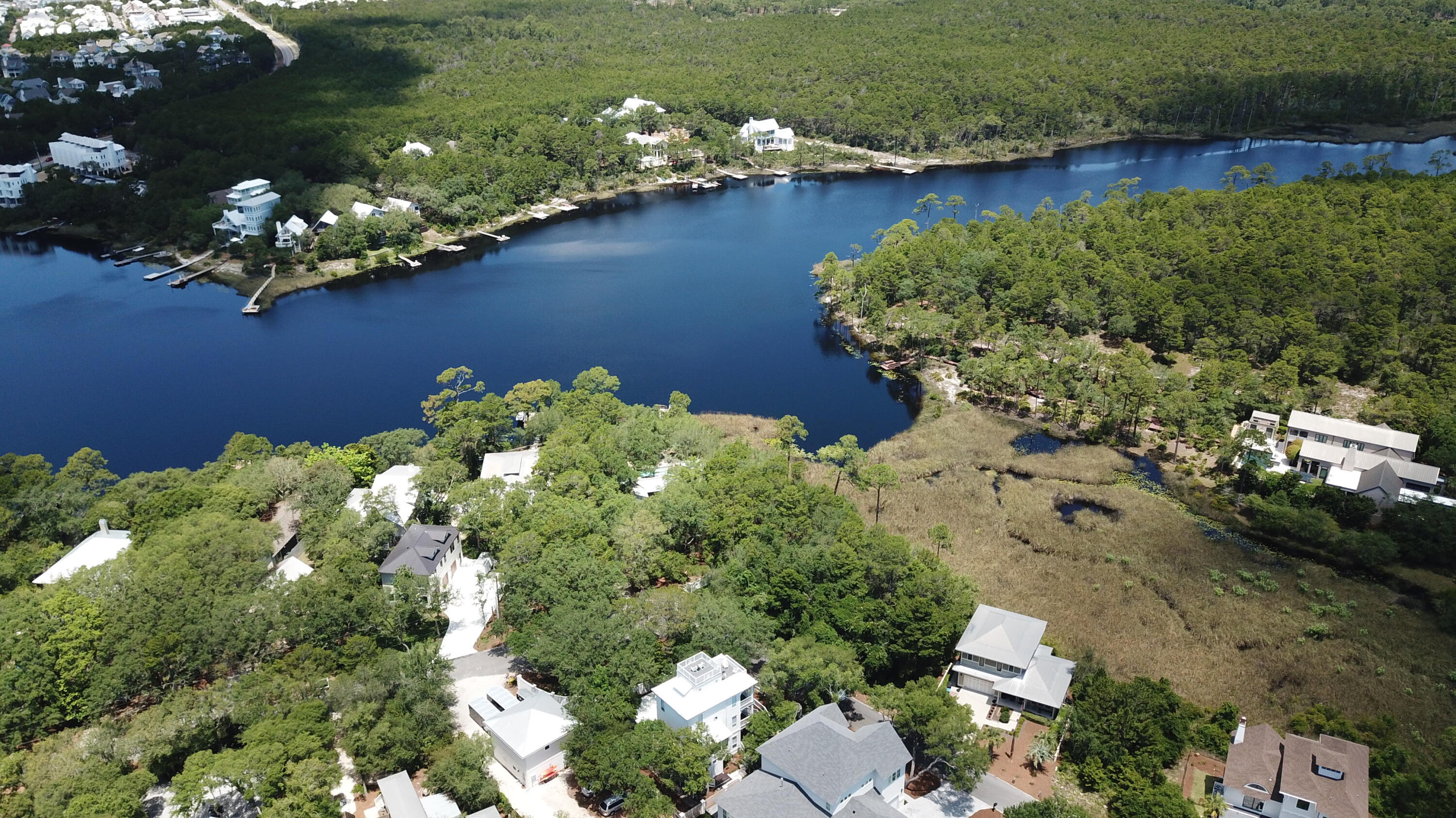 Lot 2 Cove Creek Ln Inlet Beach Inlet Beach, FL 32461 - Photo 5 of 23 a view of a lake with a yard