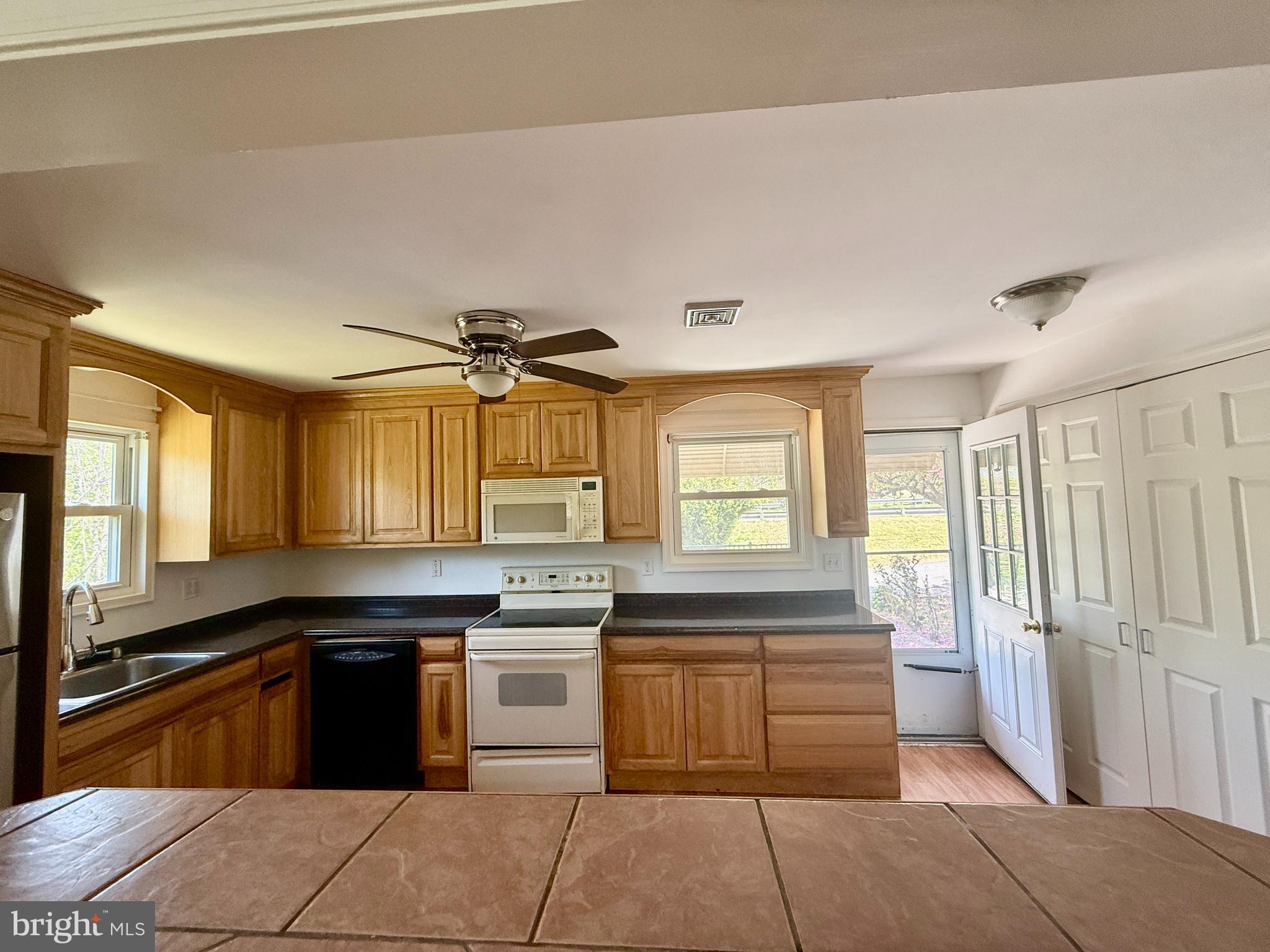 5 Copes Lane Media, PA 19063 - Photo 4 of 18 a kitchen with a sink stove and cabinets