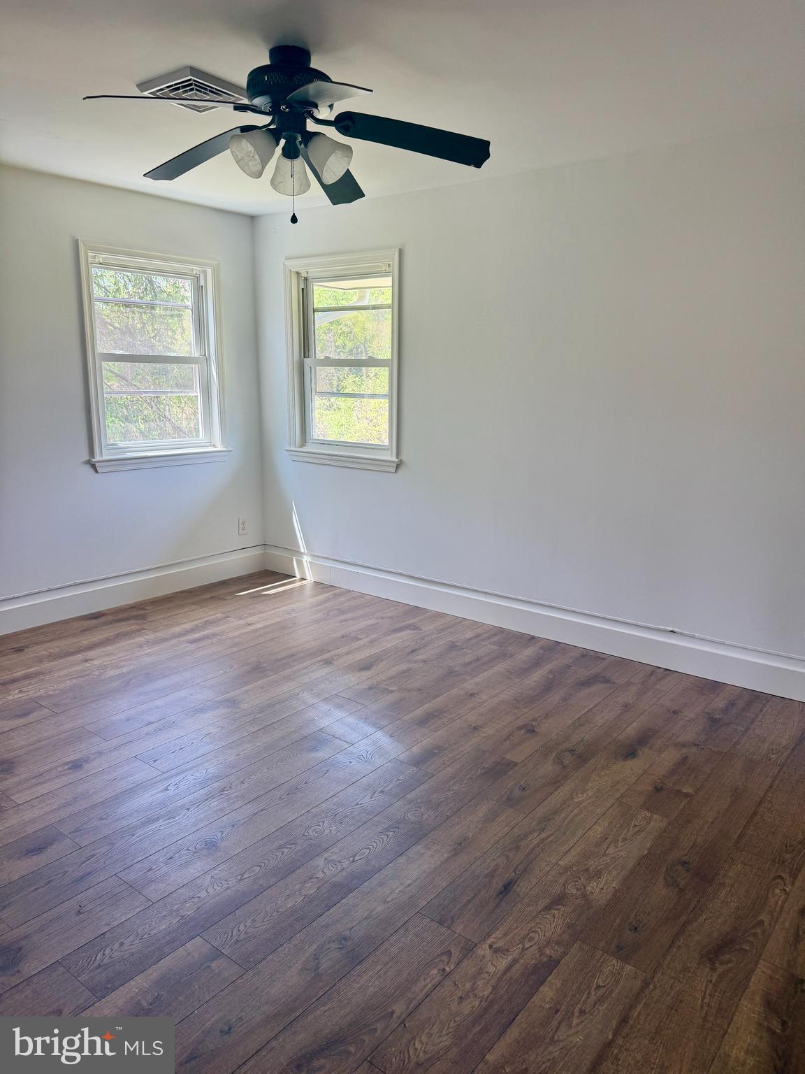 5 Copes Lane Media, PA 19063 - Photo 10 of 18 wooden floor in an empty room with a window