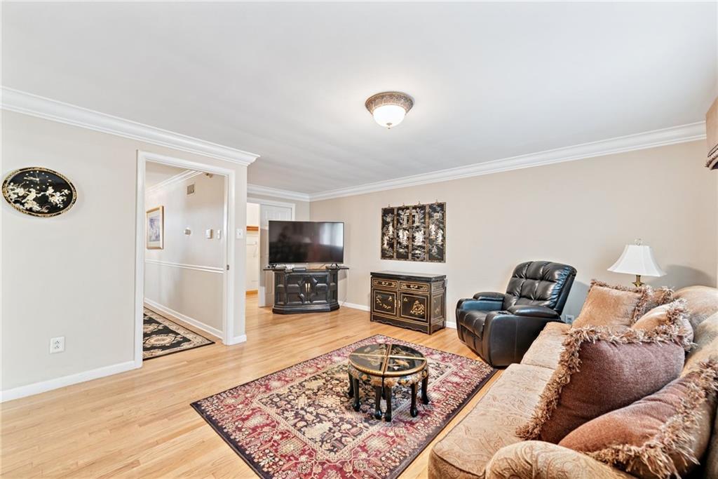 145 Herbst Road Coraopolis, PA 15108 - Photo 16 of 35 a living room with furniture and a flat screen tv