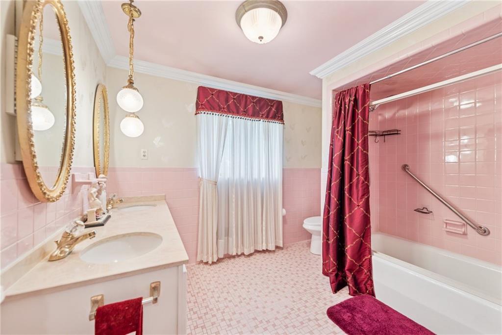 145 Herbst Road Coraopolis, PA 15108 - Photo 18 of 35 a bathroom with a sink and a mirror