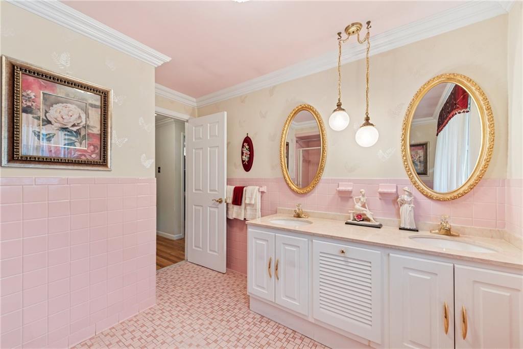 145 Herbst Road Coraopolis, PA 15108 - Photo 19 of 35 a bathroom with a sink and a mirror