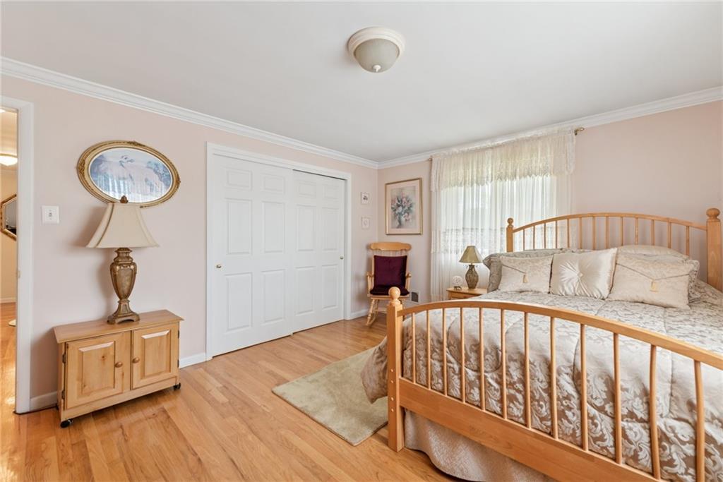 145 Herbst Road Coraopolis, PA 15108 - Photo 24 of 35 a bedroom with furniture and a wooden floor