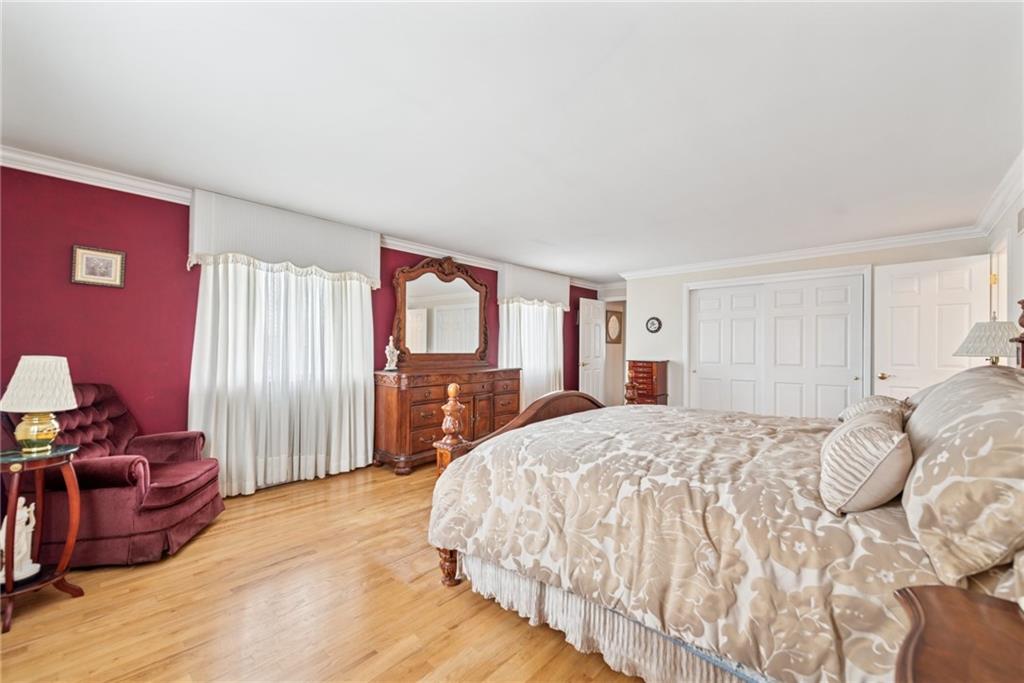145 Herbst Road Coraopolis, PA 15108 - Photo 26 of 35 a spacious bedroom with a bed dresser and a window