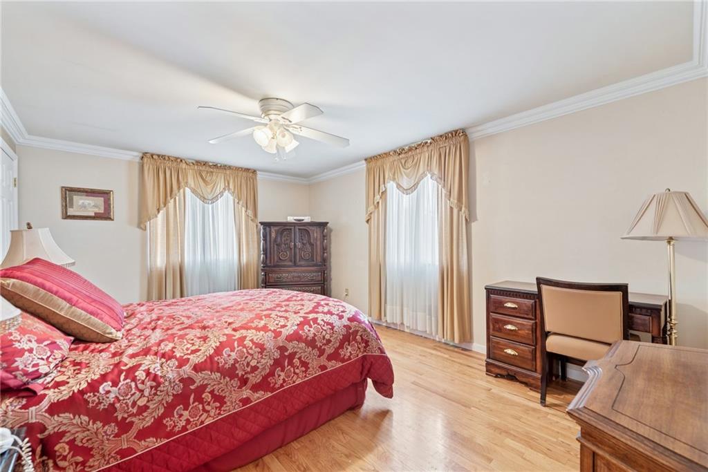 145 Herbst Road Coraopolis, PA 15108 - Photo 28 of 35 a bedroom with a bed and wooden floor