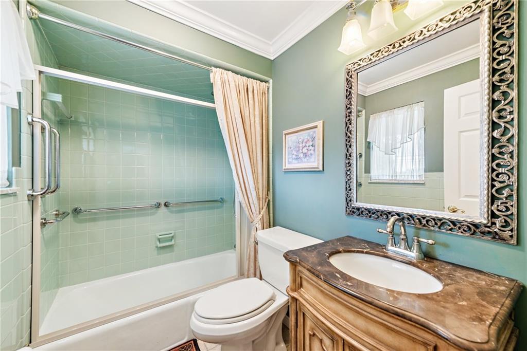 145 Herbst Road Coraopolis, PA 15108 - Photo 29 of 35 a bathroom with a granite countertop sink toilet a mirror and shower