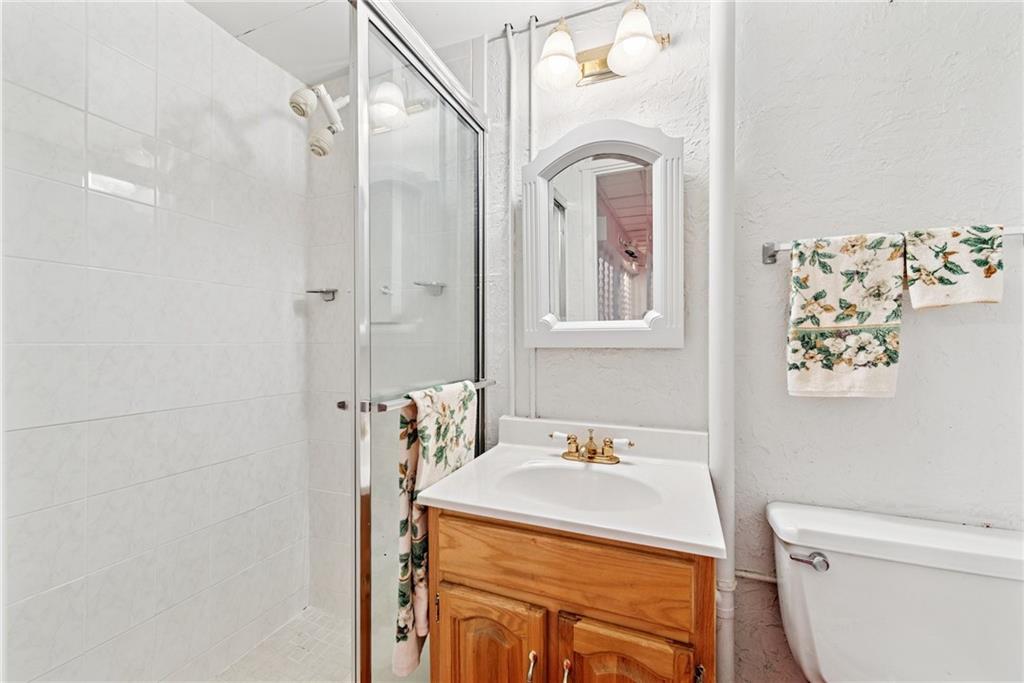 145 Herbst Road Coraopolis, PA 15108 - Photo 30 of 35 a bathroom with a sink toilet and vanity