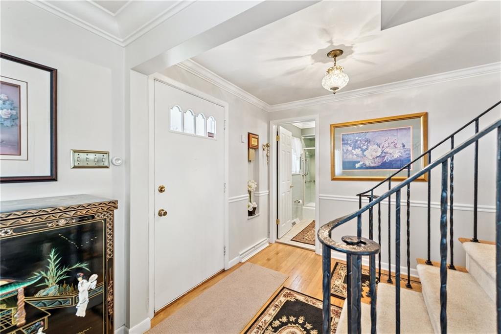 145 Herbst Road Coraopolis, PA 15108 - Photo 4 of 35 a view of a hallway with wooden floor and staircase