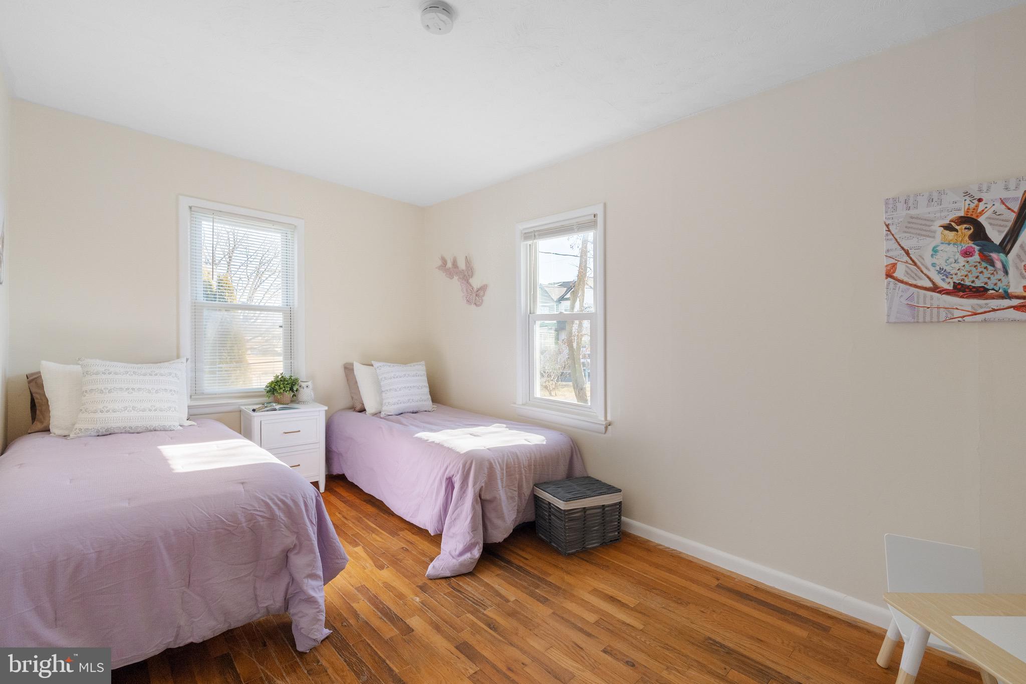 405 East 7th Avenue Ranson, WV 25438 - Photo 11 of 29 a bedroom with a bed and wooden floor