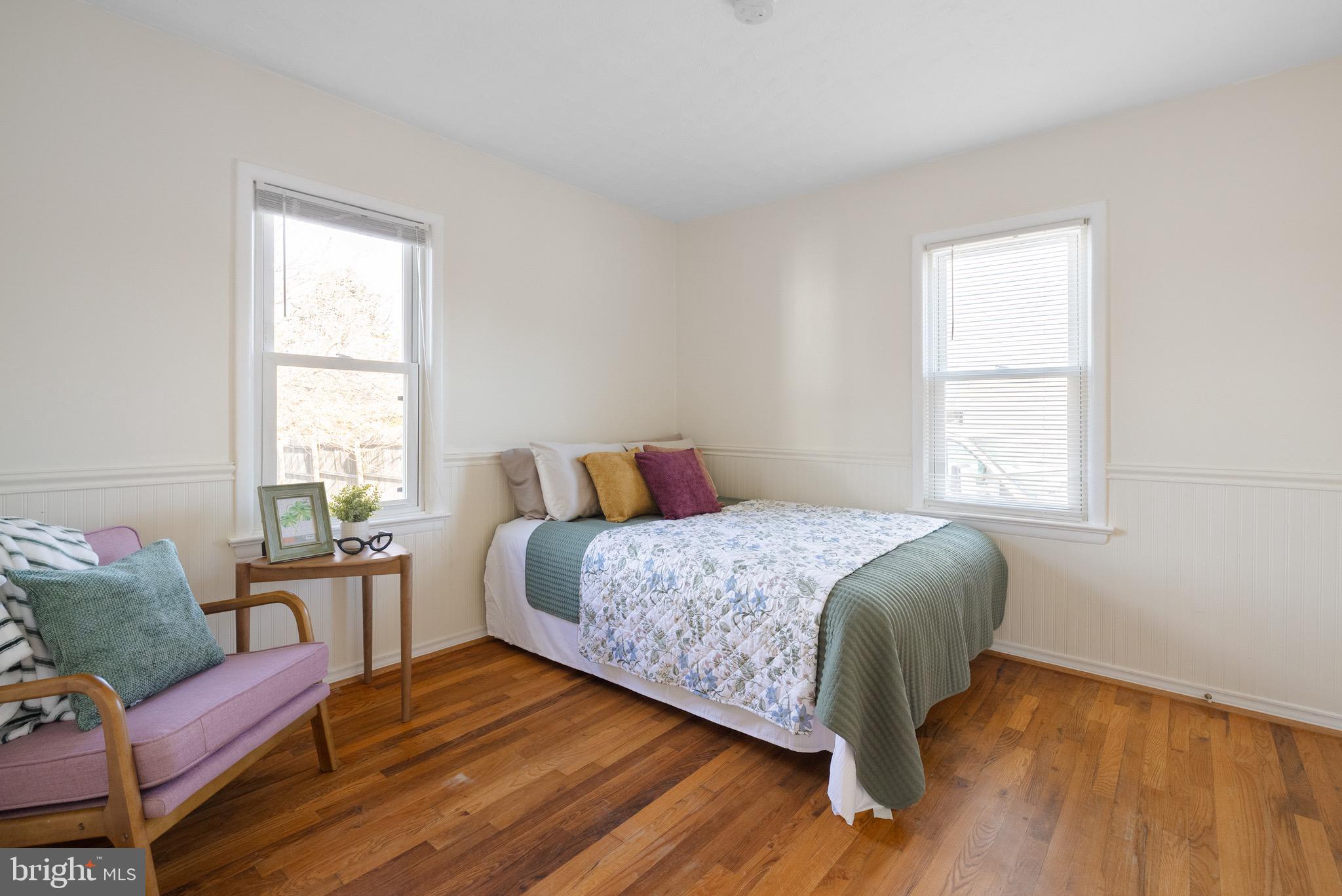 405 East 7th Avenue Ranson, WV 25438 - Photo 12 of 29 a bedroom with a bed and wooden floor