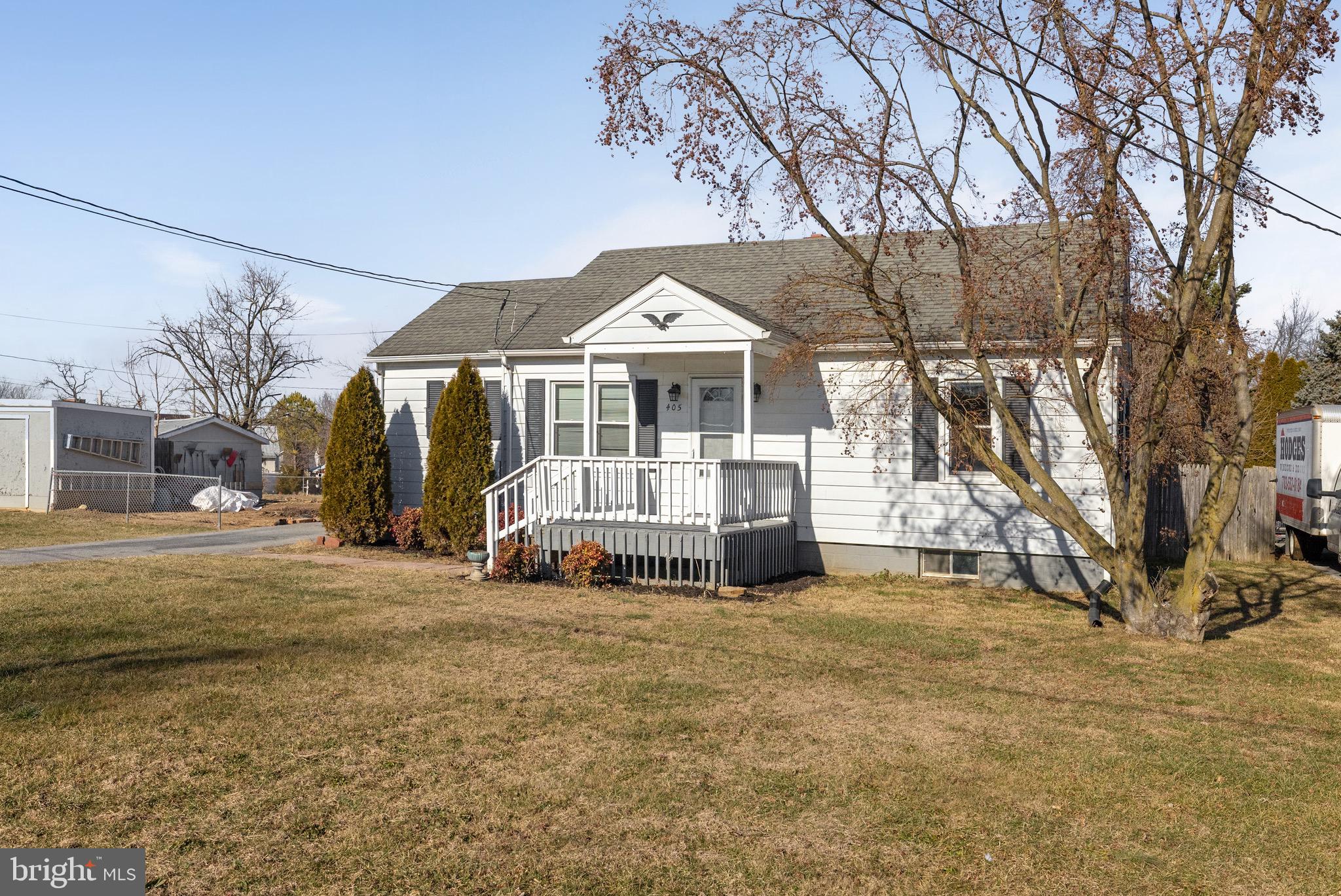 405 East 7th Avenue Ranson, WV 25438 - Photo 27 of 29 a view of a house with a big yard and large trees