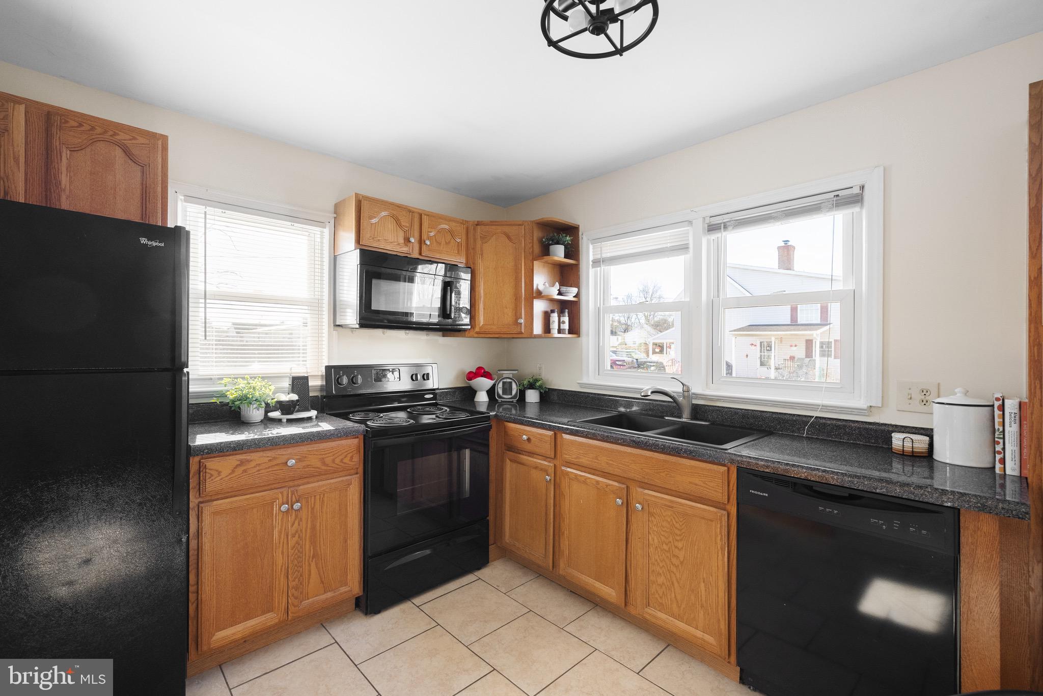 405 East 7th Avenue Ranson, WV 25438 - Photo 5 of 29 a kitchen with a sink stove and refrigerator