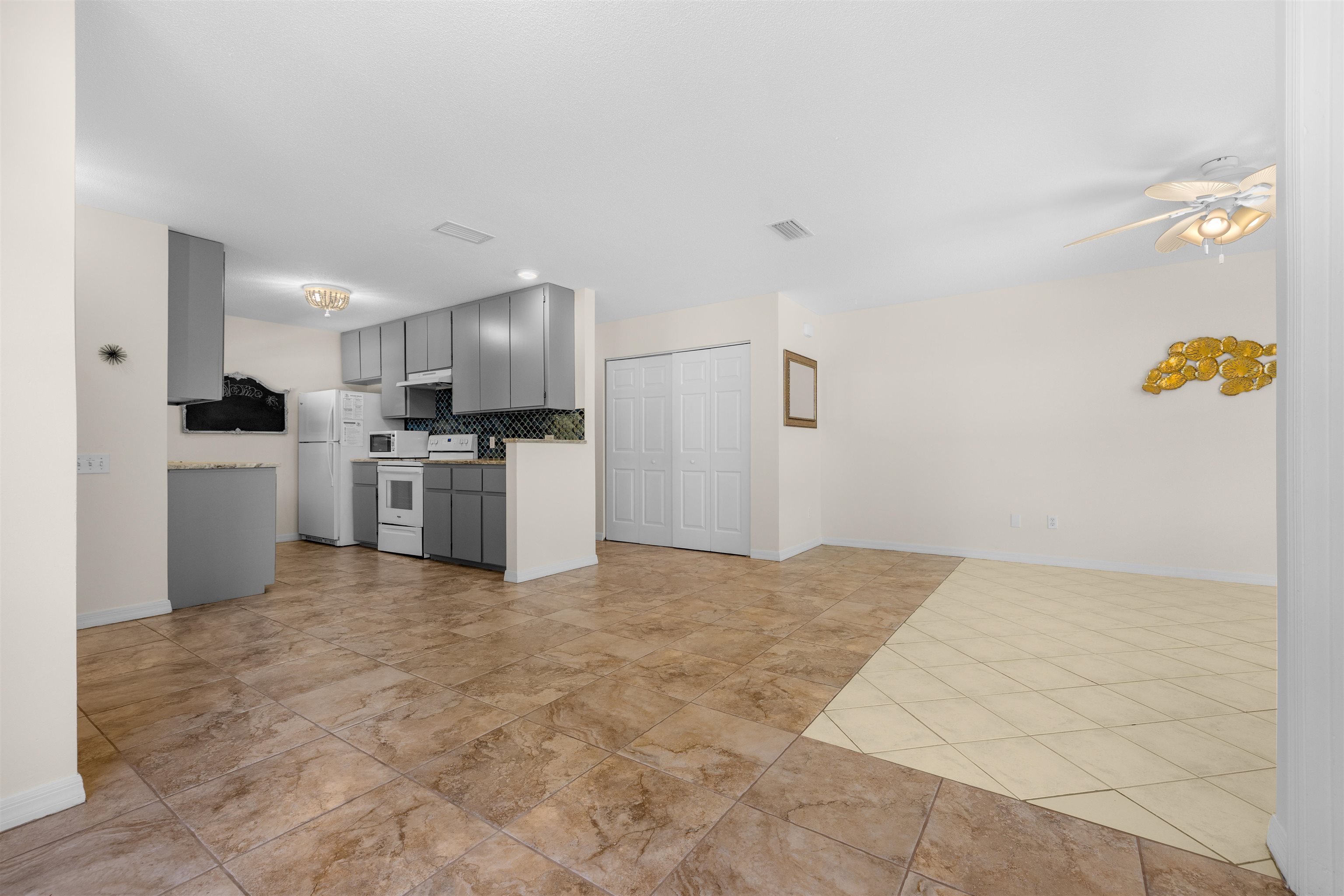 109 B Street, Unit B St. Augustine Beach, FL 32080 - Photo 30 of 30 a open kitchen with cabinets and stainless steel appliances