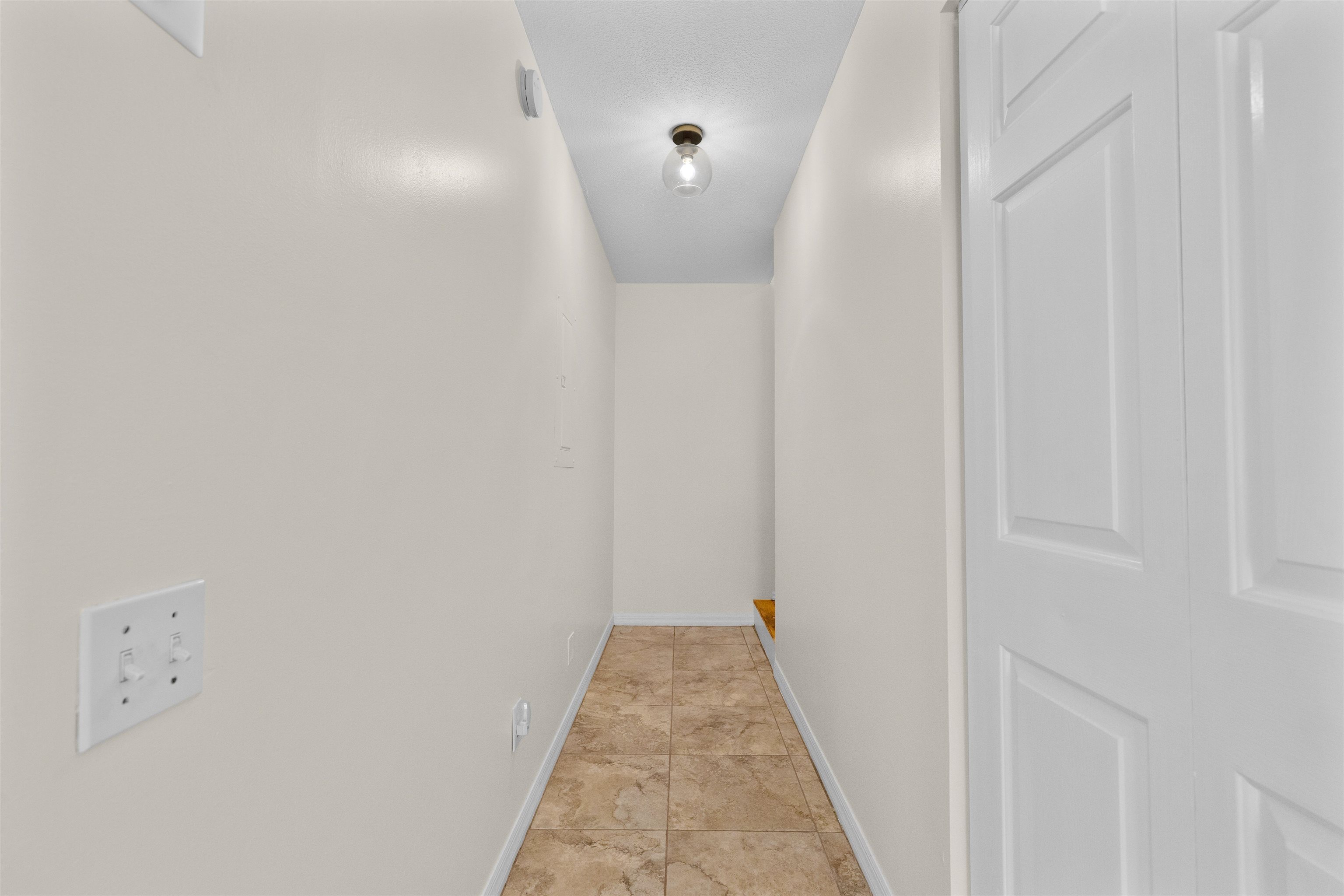 109 B Street, Unit B St. Augustine Beach, FL 32080 - Photo 12 of 30 a view of a hallway with wooden floor