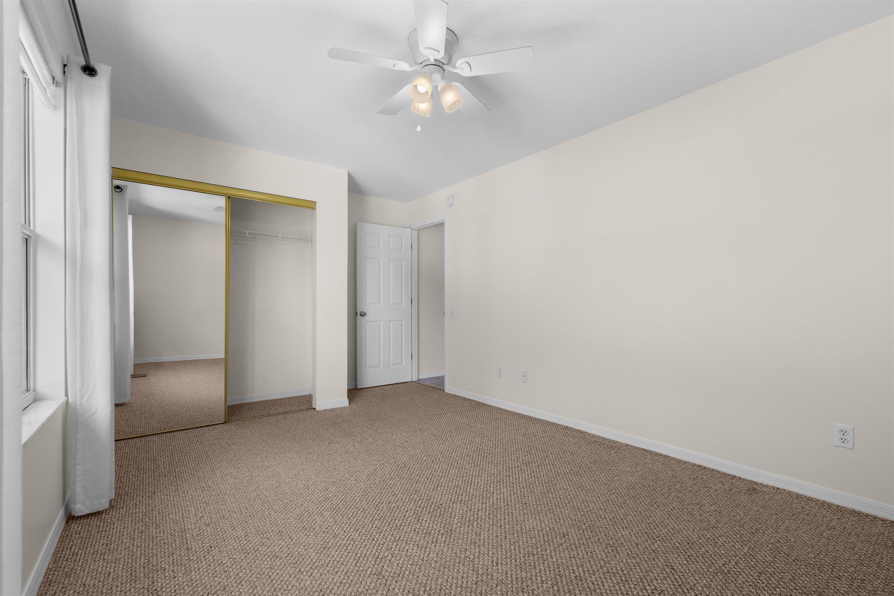 109 B Street, Unit B St. Augustine Beach, FL 32080 - Photo 15 of 30 an empty room with fan and entrance