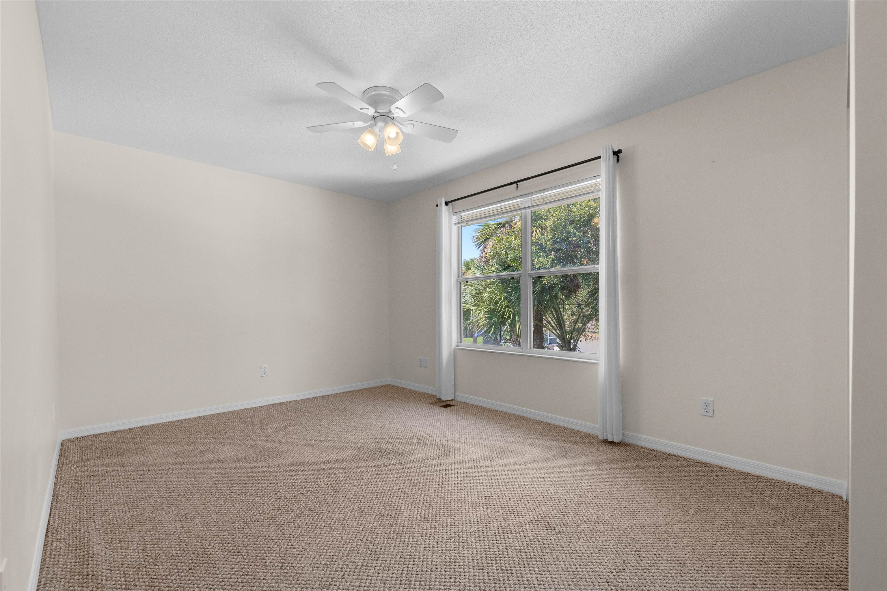 109 B Street, Unit B St. Augustine Beach, FL 32080 - Photo 16 of 30 a view of an empty room with a window