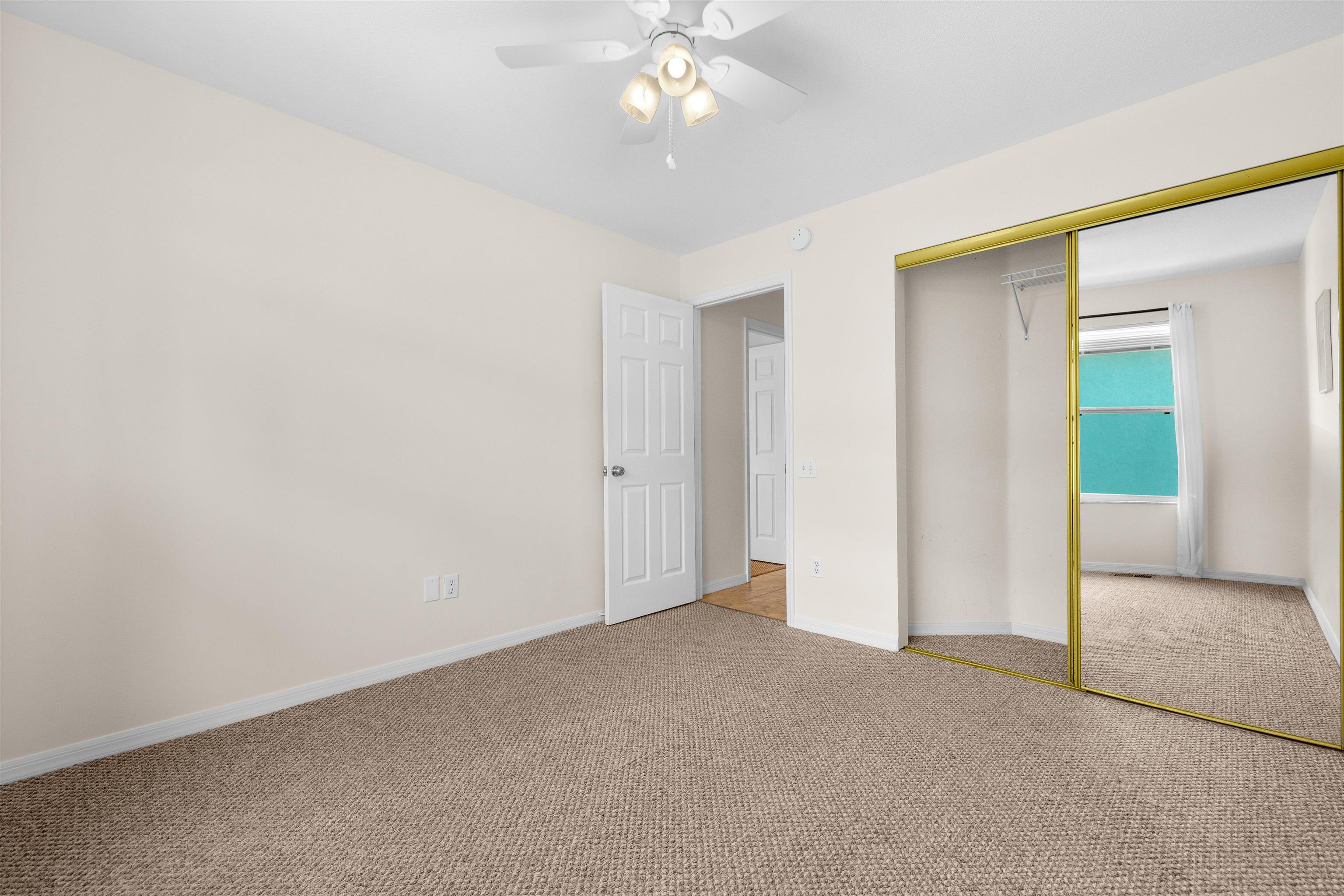 109 B Street, Unit B St. Augustine Beach, FL 32080 - Photo 19 of 30 an empty room with fan and entrance