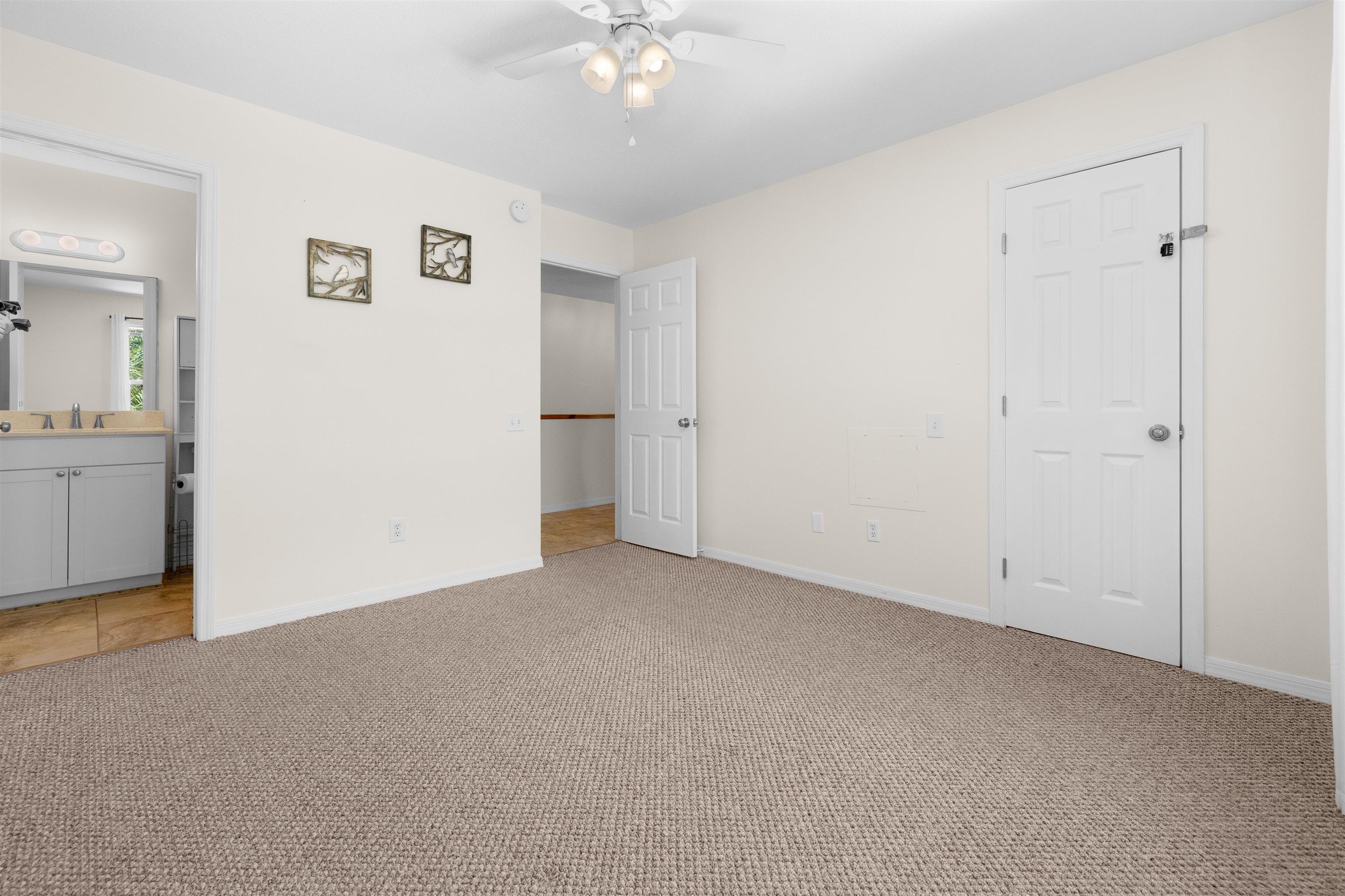 109 B Street, Unit B St. Augustine Beach, FL 32080 - Photo 21 of 30 an empty room with chandelier fan