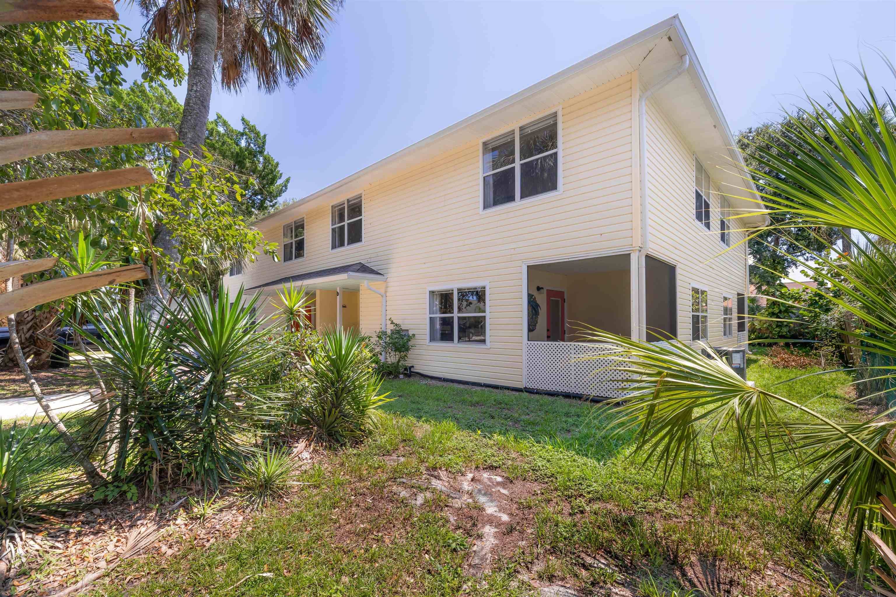 109 B Street, Unit B St. Augustine Beach, FL 32080 - Photo 26 of 30 a front view of a house with a garden