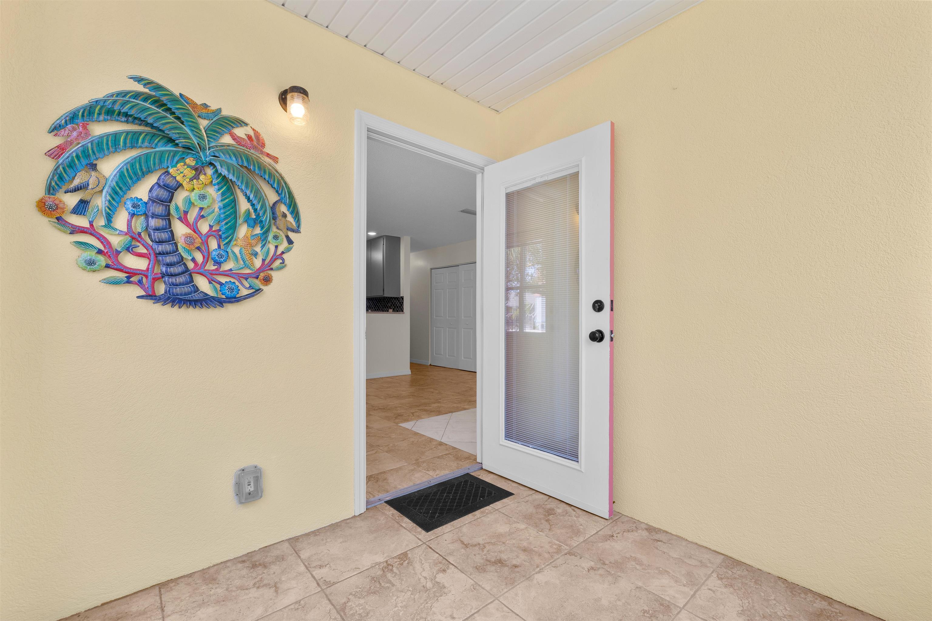 109 B Street, Unit B St. Augustine Beach, FL 32080 - Photo 10 of 30 an empty room with painting on the wall