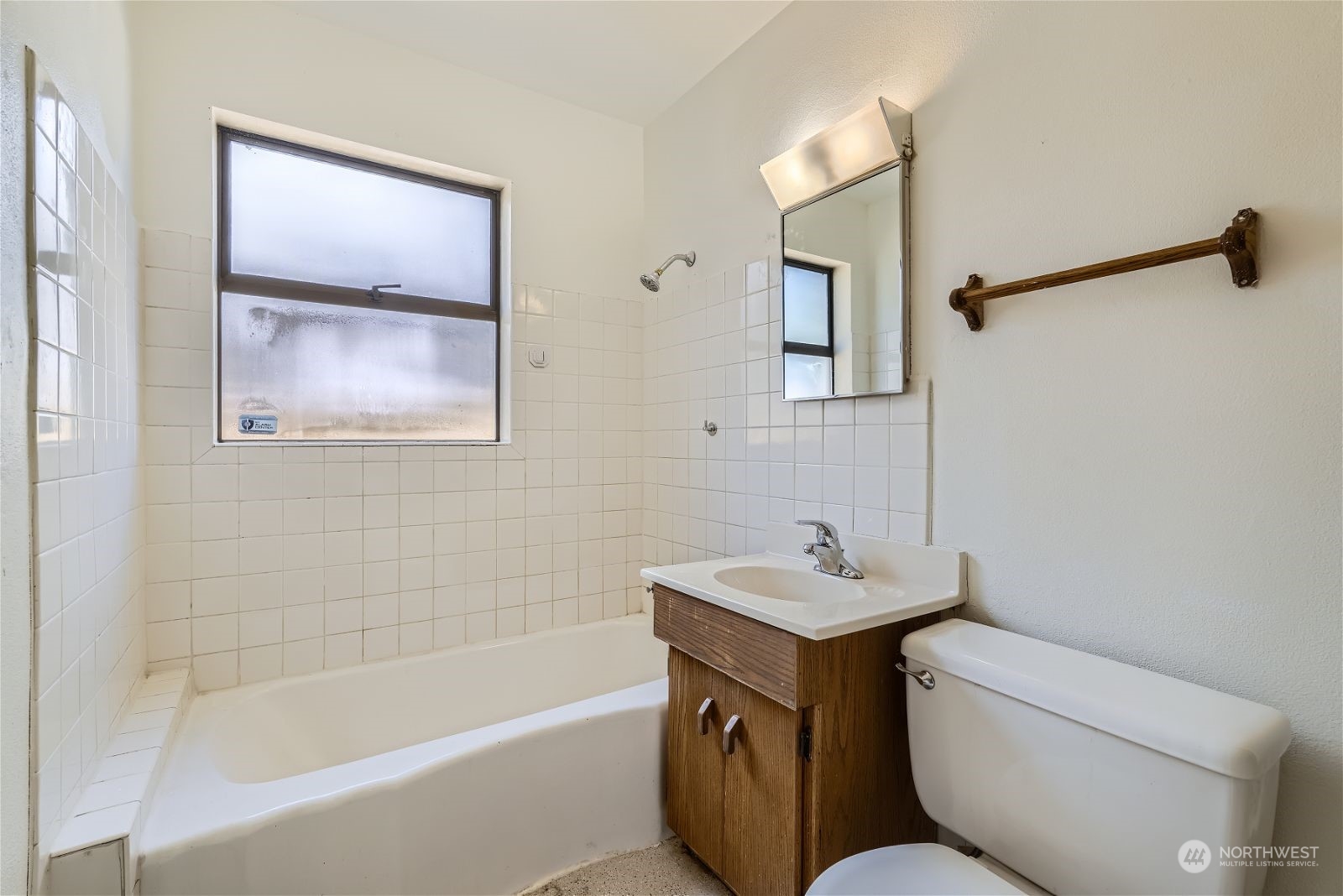 730 North 67th Street Seattle, WA 98103 - Photo 12 of 37 a bathroom with a toilet sink and mirror