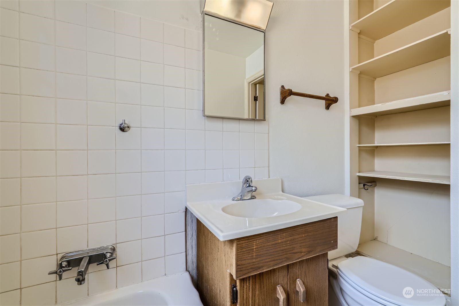 730 North 67th Street Seattle, WA 98103 - Photo 13 of 37 a bathroom with a sink toilet and vanity