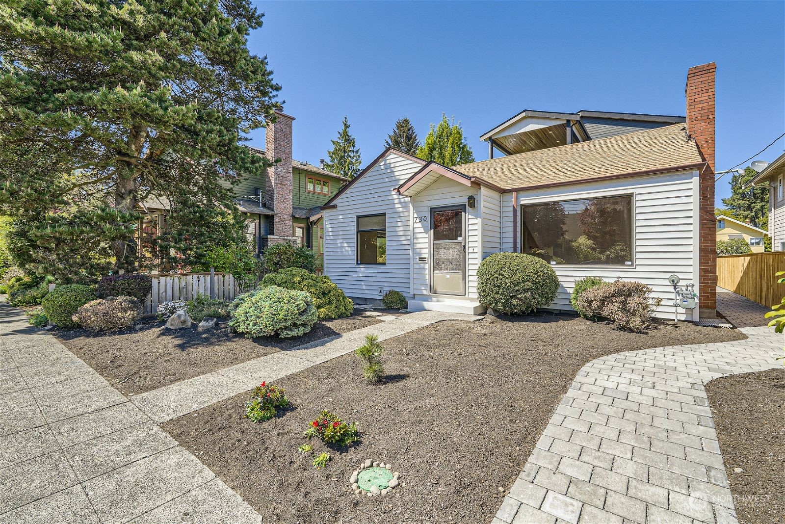 730 North 67th Street Seattle, WA 98103 - Photo 2 of 37 a front view of a house with a yard