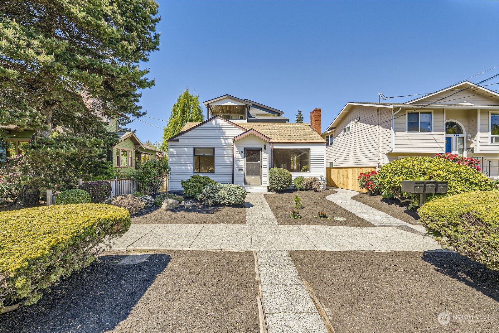 730 North 67th Street Seattle, WA 98103 - Photo 3 of 37 a front view of a house with garden