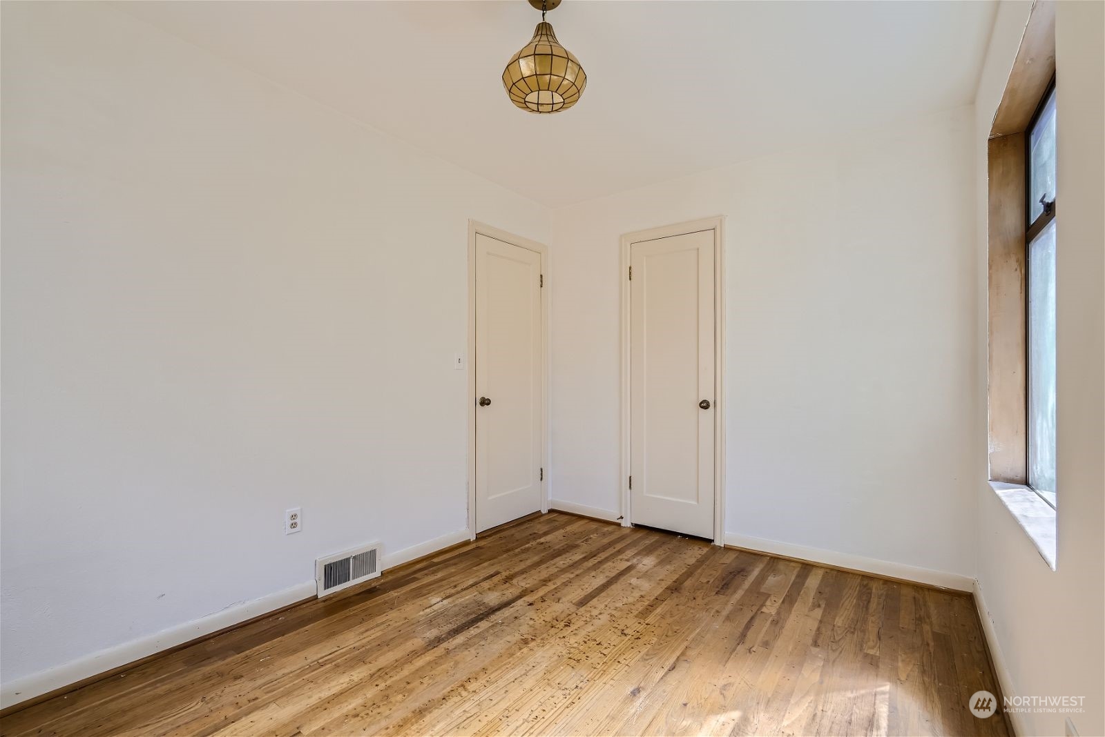 730 North 67th Street Seattle, WA 98103 - Photo 37 of 37 a view of a room with wooden floor and window