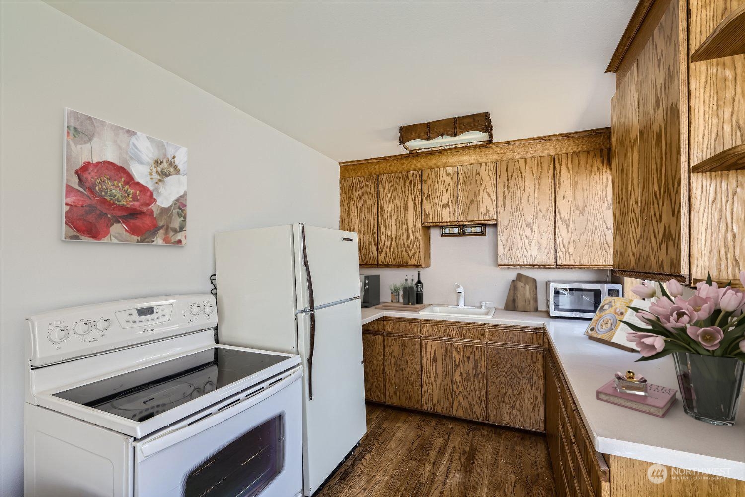 730 North 67th Street Seattle, WA 98103 - Photo 9 of 37 a kitchen with a refrigerator and a stove top oven