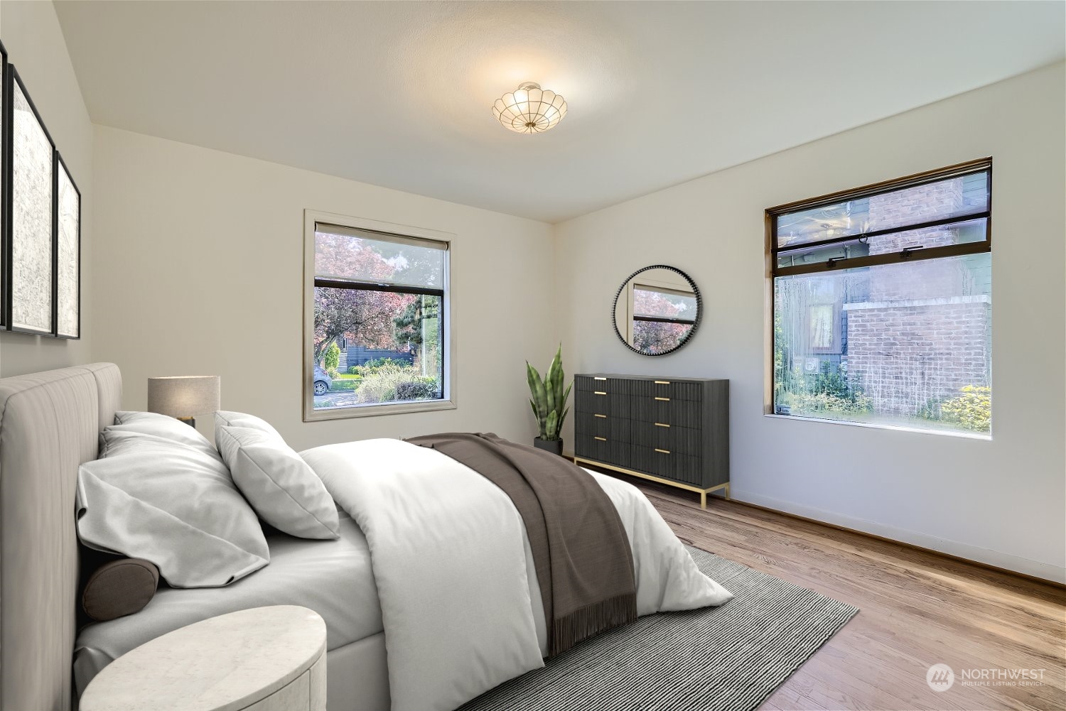 730 North 67th Street Seattle, WA 98103 - Photo 10 of 37 a bedroom with a bed a mirror on the wall and a window