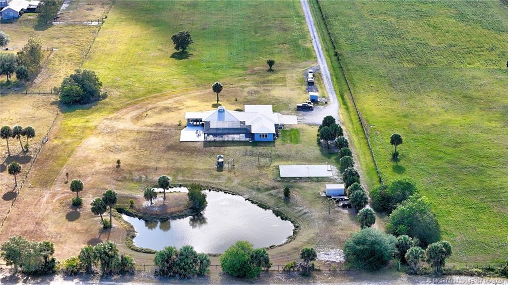 2366 South Brocksmith Road Fort Pierce, FL 34945 - Photo 3 of 49 an aerial view of residential houses with outdoor space