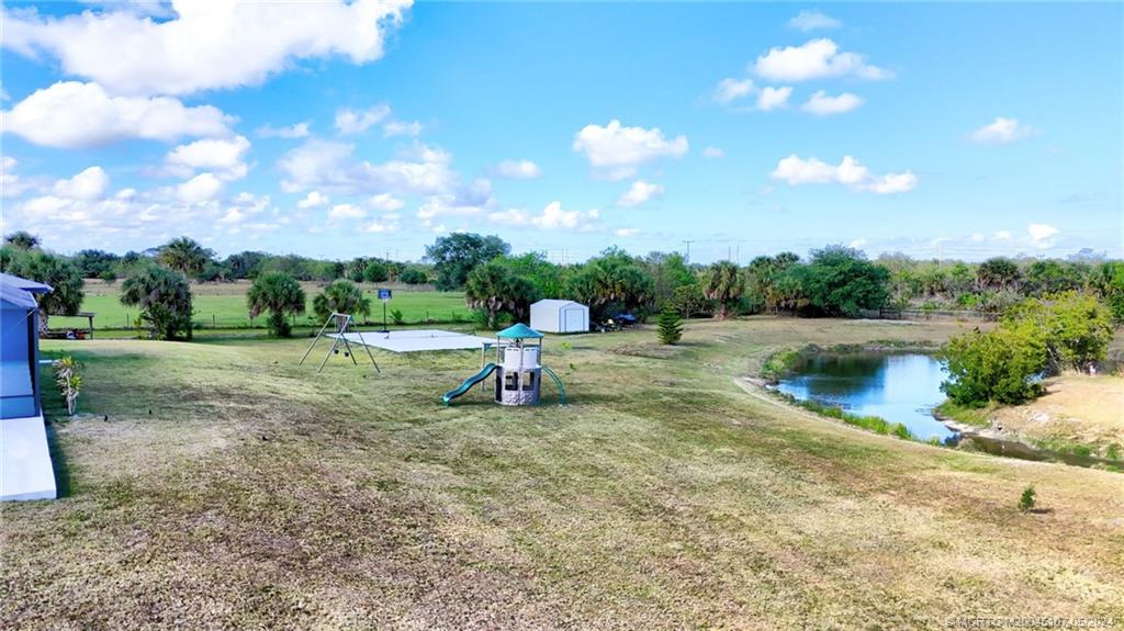 2366 South Brocksmith Road Fort Pierce, FL 34945 - Photo 36 of 49 a view of a lake with a yard