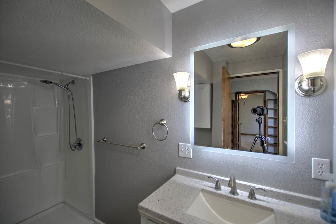 204 West South Street Clinton, IL 61727 - Photo 13 of 23 a bathroom with a sink a toilet and shower