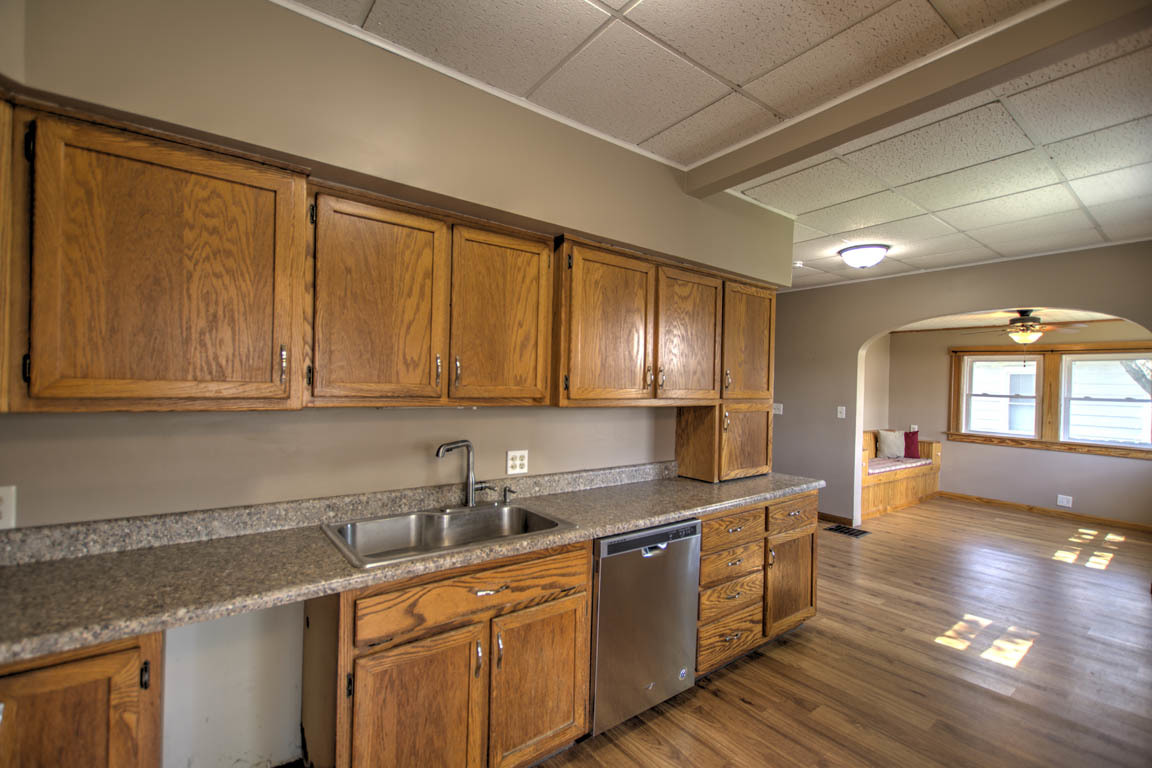 204 West South Street Clinton, IL 61727 - Photo 6 of 23 a kitchen with stainless steel appliances granite countertop a sink stove and cabinets