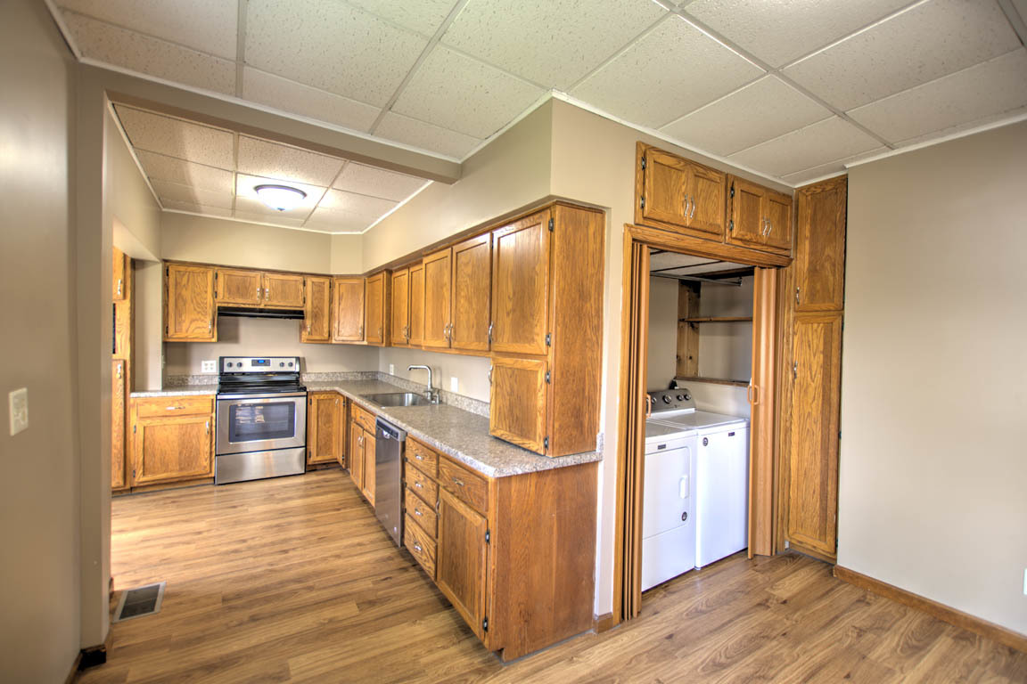 204 West South Street Clinton, IL 61727 - Photo 7 of 23 a kitchen with stainless steel appliances granite countertop a stove and a refrigerator