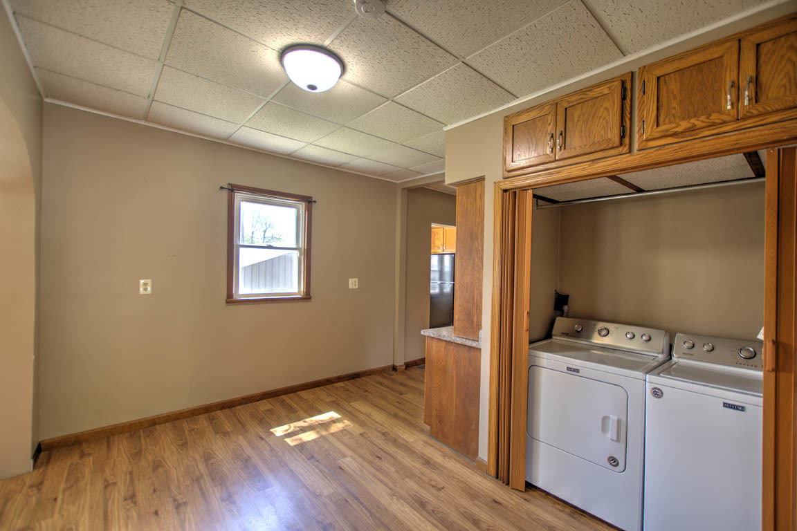 204 West South Street Clinton, IL 61727 - Photo 10 of 23 a view of storage and utility room with wooden floor