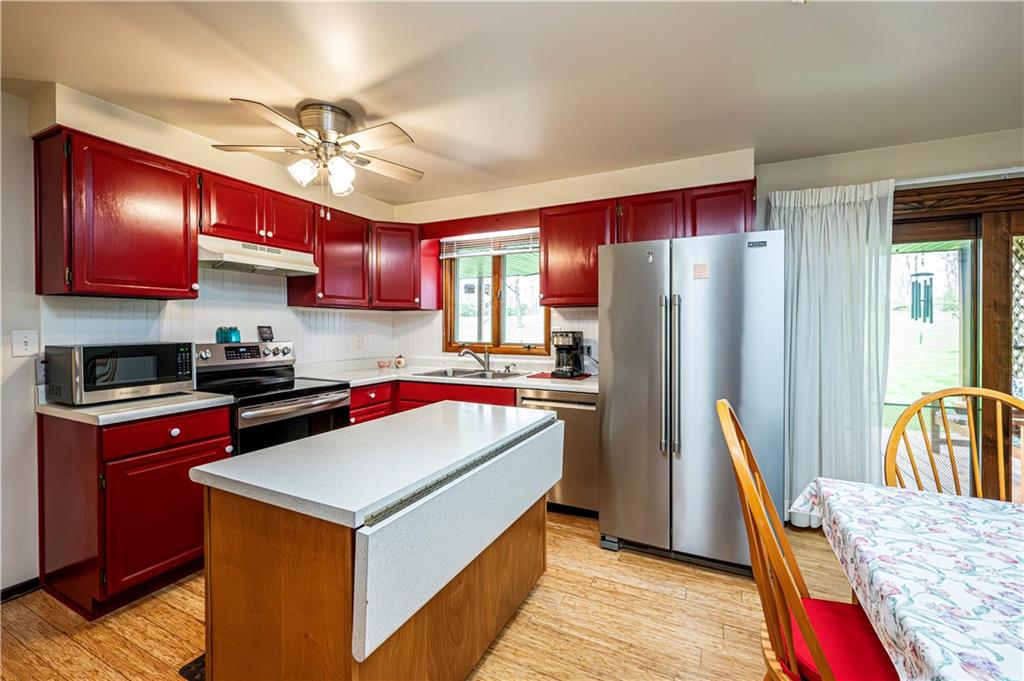 361 Middletown Road New Stanton, PA 15672 - Photo 13 of 43 a kitchen with kitchen island a counter top space appliances and cabinets