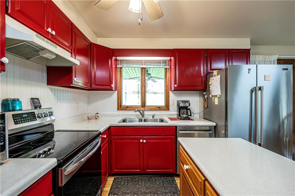361 Middletown Road New Stanton, PA 15672 - Photo 15 of 43 a kitchen with stainless steel appliances granite countertop a refrigerator sink stove microwave and cabinets
