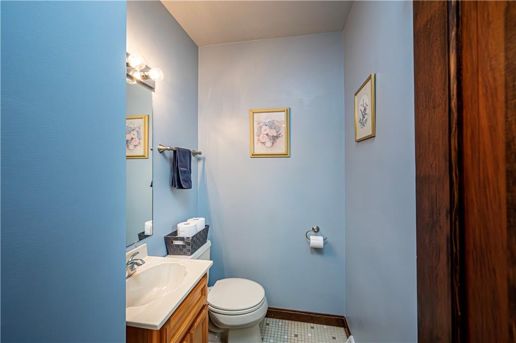 361 Middletown Road New Stanton, PA 15672 - Photo 17 of 43 a white toilet sitting next to a bathroom sink and vanity
