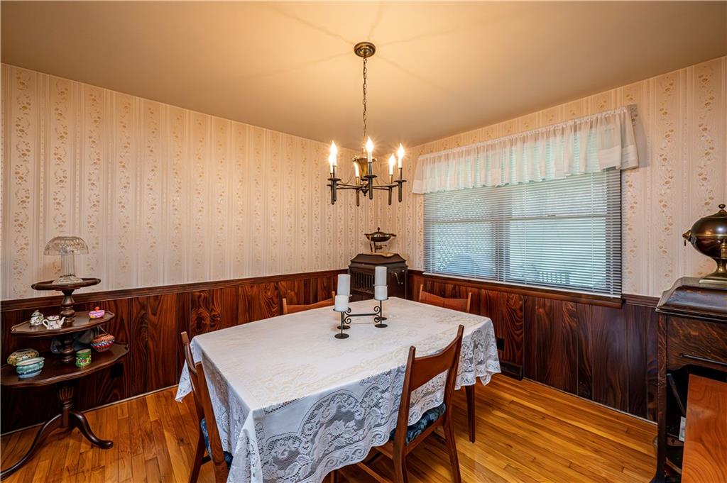 361 Middletown Road New Stanton, PA 15672 - Photo 18 of 43 a view of a dining room with furniture and wooden floor