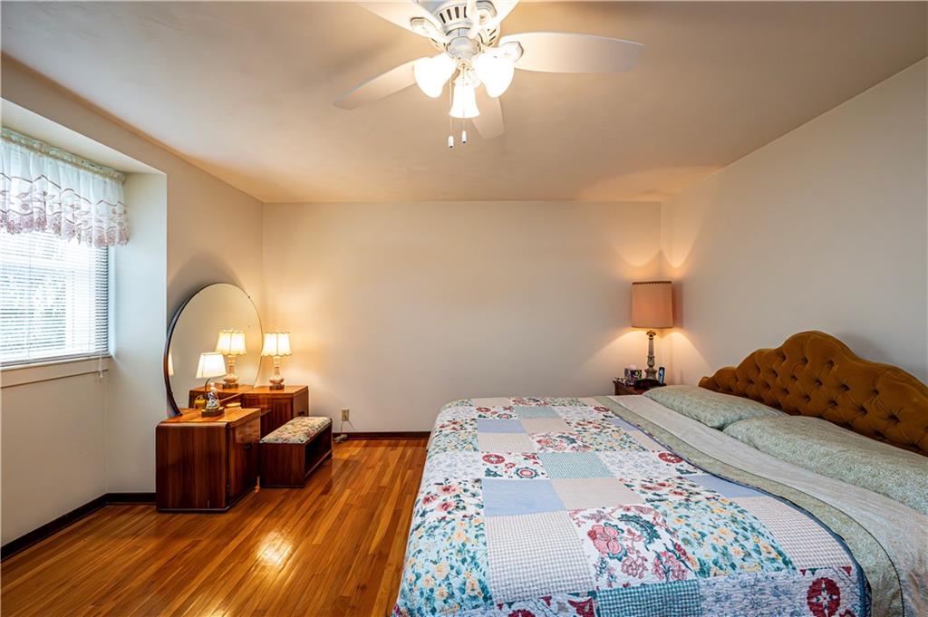 361 Middletown Road New Stanton, PA 15672 - Photo 19 of 43 a bedroom with a bed and a chandelier