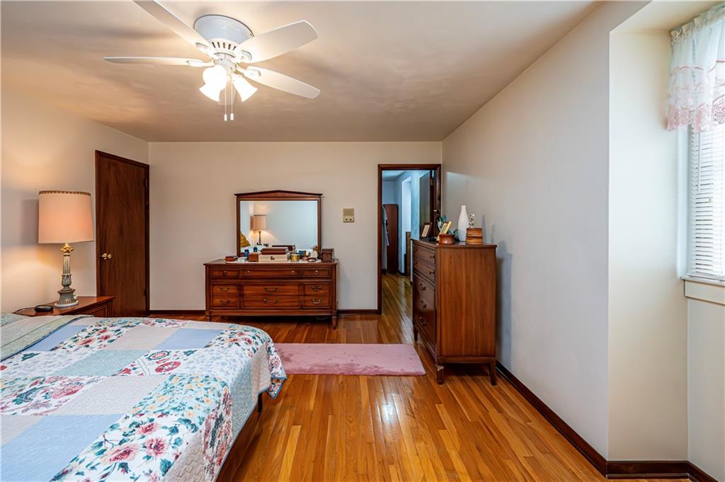 361 Middletown Road New Stanton, PA 15672 - Photo 20 of 43 a bedroom with a bed and wooden floor