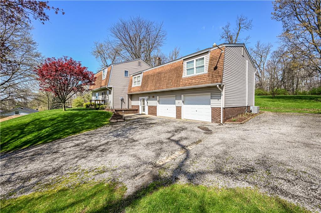 361 Middletown Road New Stanton, PA 15672 - Photo 2 of 43 a view of a white house with a yard and large tree