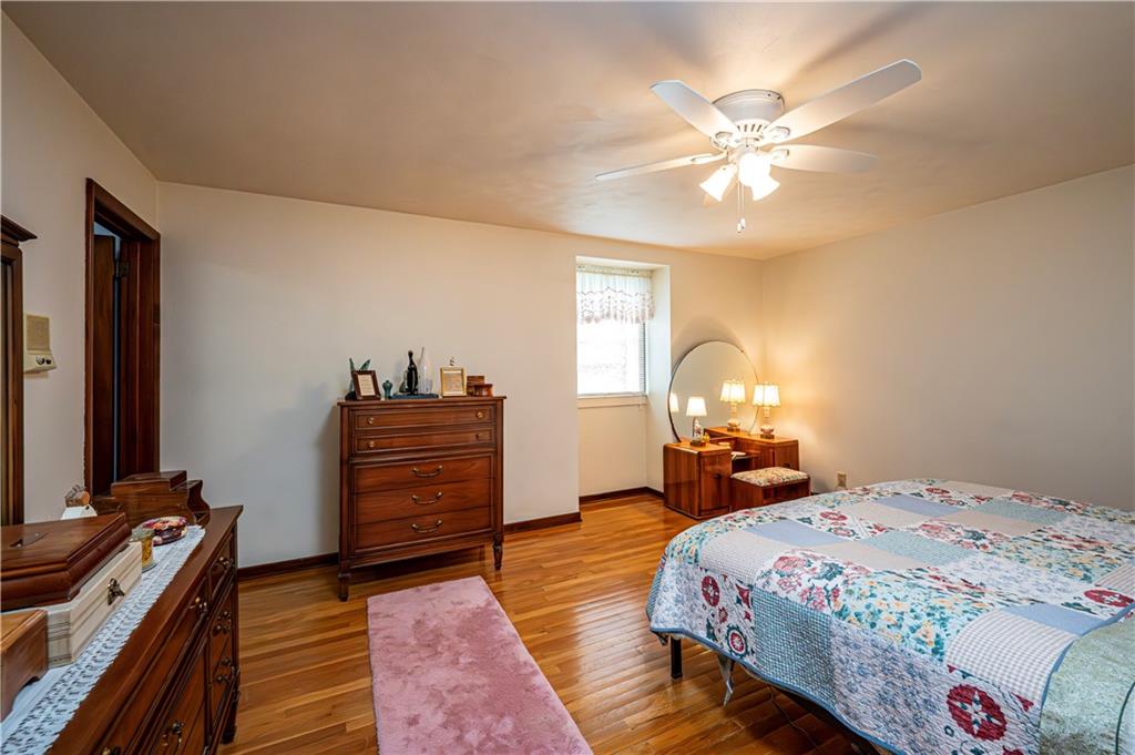 361 Middletown Road New Stanton, PA 15672 - Photo 21 of 43 a bedroom with a bed and wooden floor
